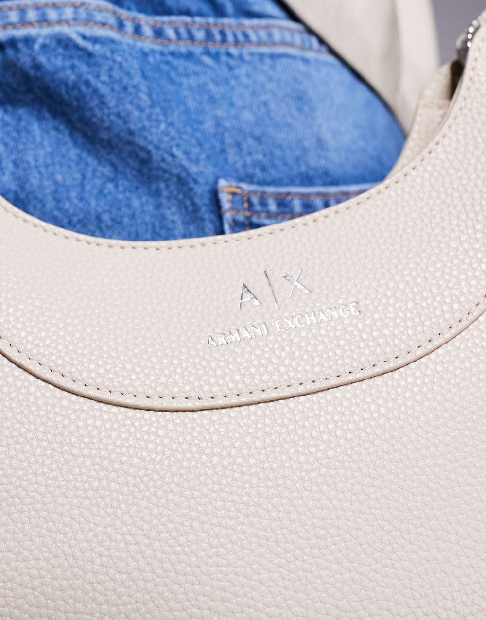 Armani Exchange curved logo shoulder bag in cream