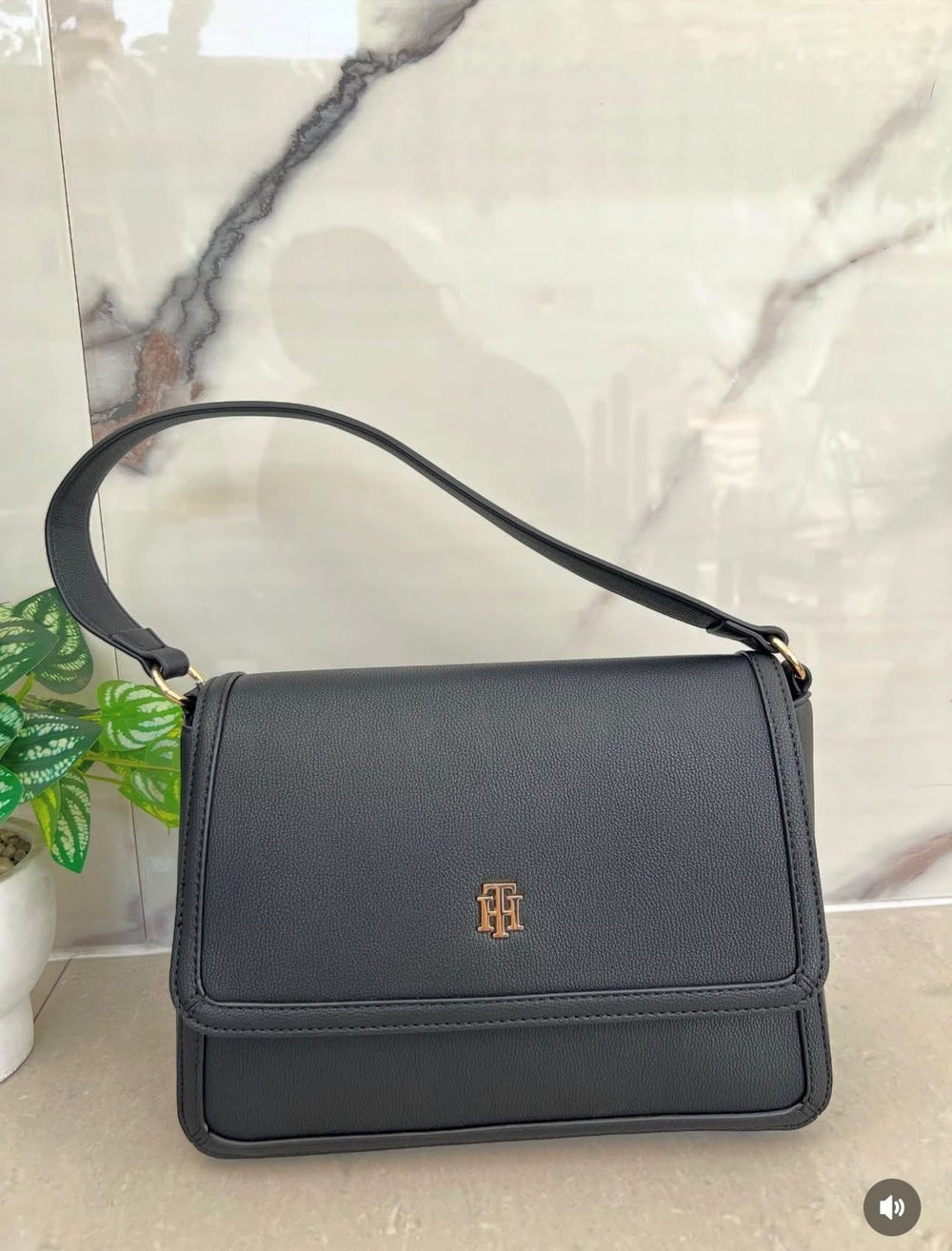 Tommy Hilfiger crossbody bag in faux leather with a signature logo on the front