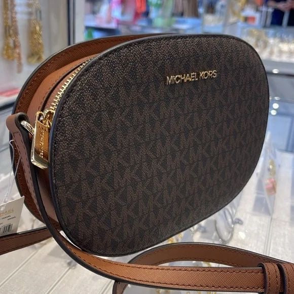 Jet Set Travel Medium Signature Oval Crossbody