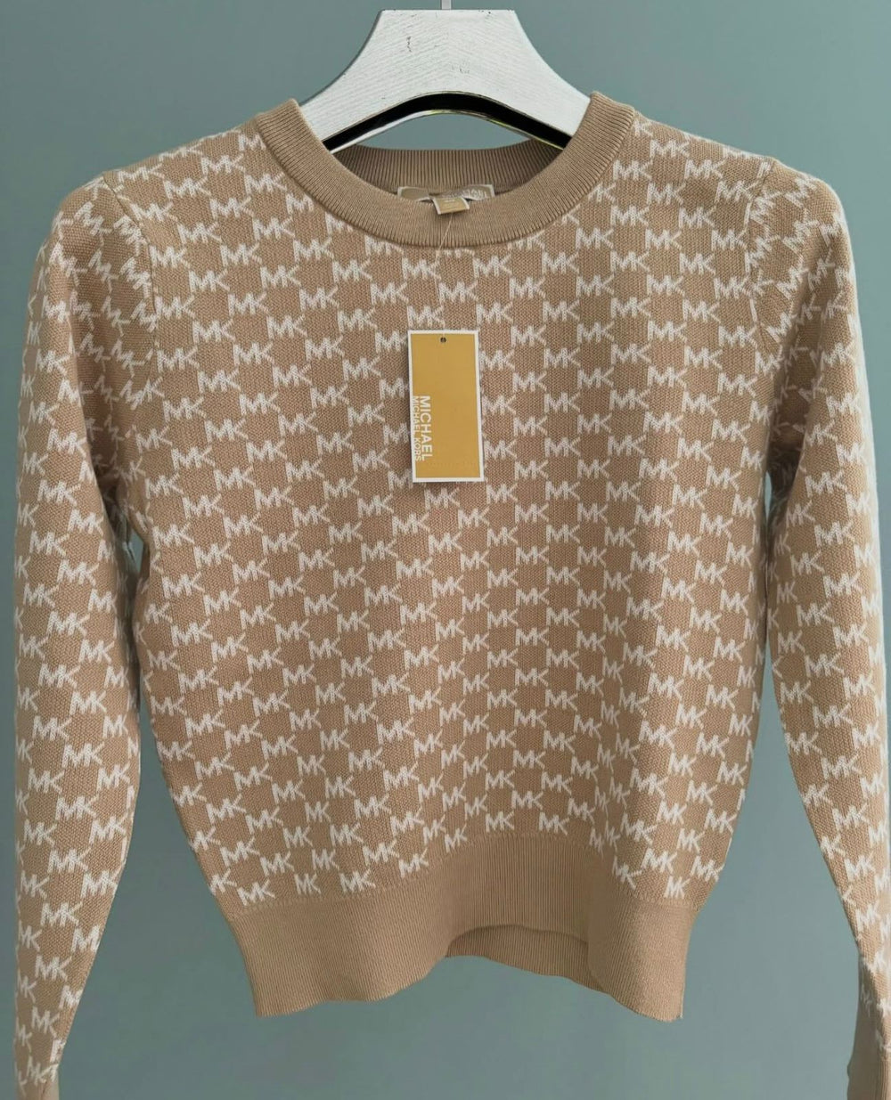 Michael Kors sweater in a tan and white all-over "MK" logo print