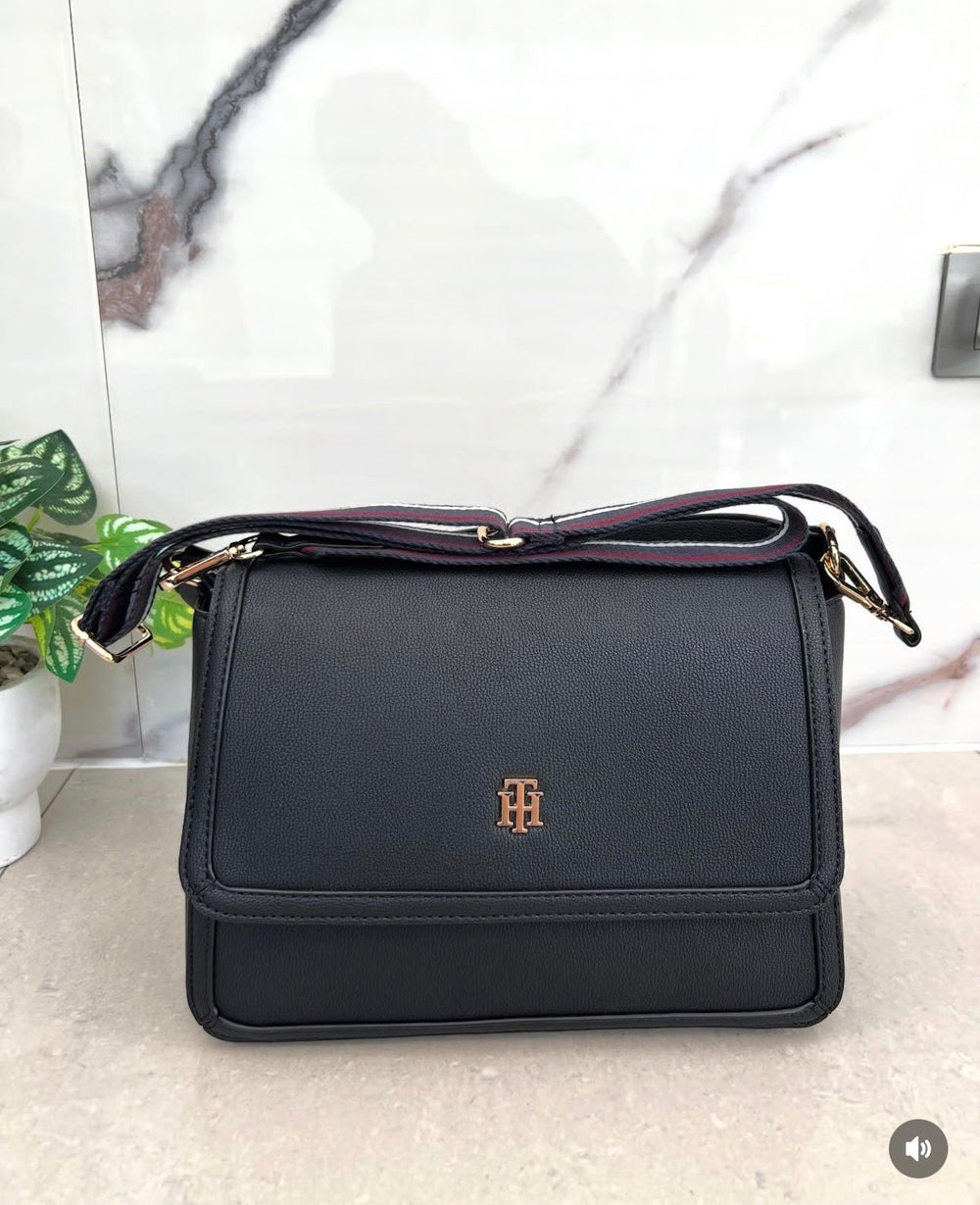 Tommy Hilfiger crossbody bag in faux leather with a signature logo on the front