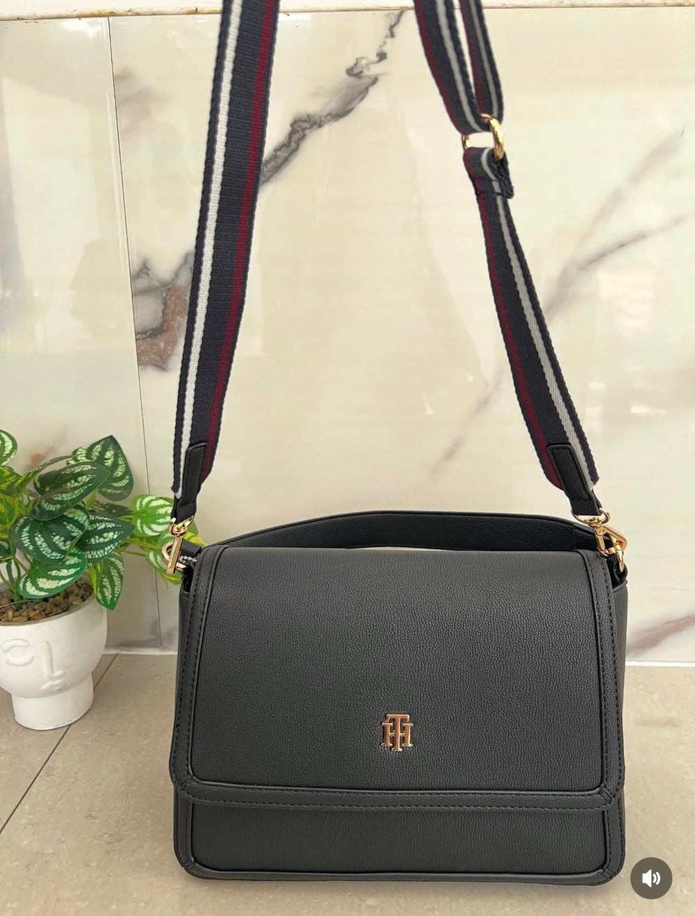 Tommy Hilfiger crossbody bag in faux leather with a signature logo on the front